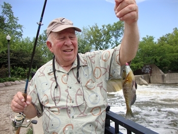 Angler Don Dubin displays a fish he just caught from the Chicago River