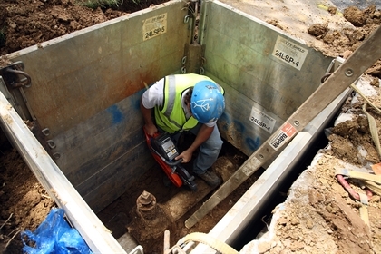 A worker repairs pipes in the ongoing battle to stop leaks.