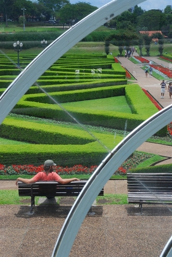 Man sitting at Curitiba Botanical Gardens