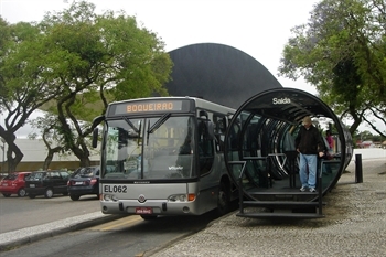 Rapid transit bus at a bus stop in Curitiba