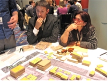 Greenbuild attendees use building blocks to create a green neighborhood.